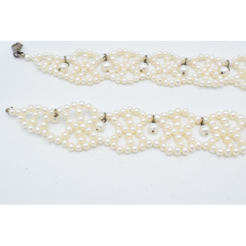 408 - A pair of silver mounted pearl bracelets, 19.5cm long (2).