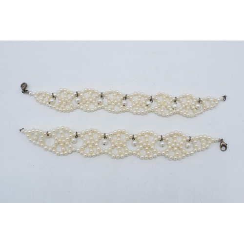 408 - A pair of silver mounted pearl bracelets, 19.5cm long (2).