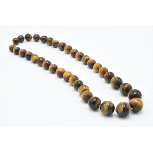 409 - Vintage tiger's eye beaded necklace, 58cm long, with graduated beads.