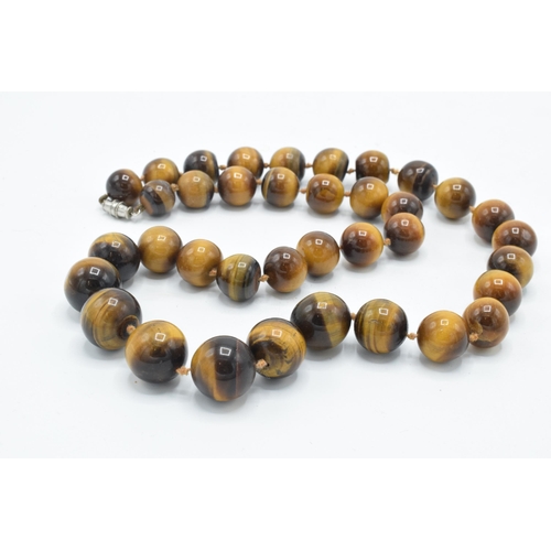 409 - Vintage tiger's eye beaded necklace, 58cm long, with graduated beads.