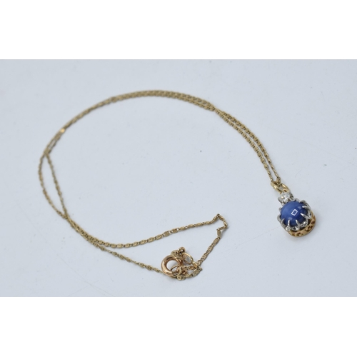 410 - 18ct gold chain and pendant set with a sapphire and a diamond, 2.9 grams, chain 42cm long.