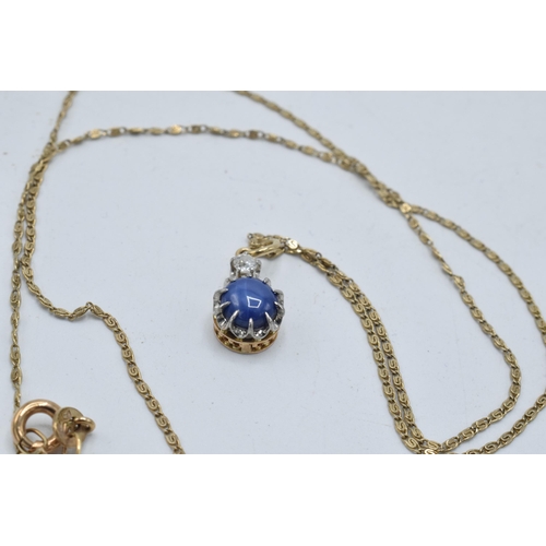 410 - 18ct gold chain and pendant set with a sapphire and a diamond, 2.9 grams, chain 42cm long.