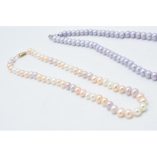 416 - A collection of 4 faux pearl necklaces of varying colours (4).