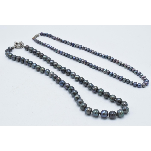 416 - A collection of 4 faux pearl necklaces of varying colours (4).