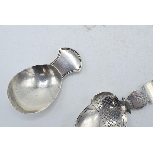 60 - A pair of George III silver caddy spoons to include an acorn-shaped example with bright cut engravin... 