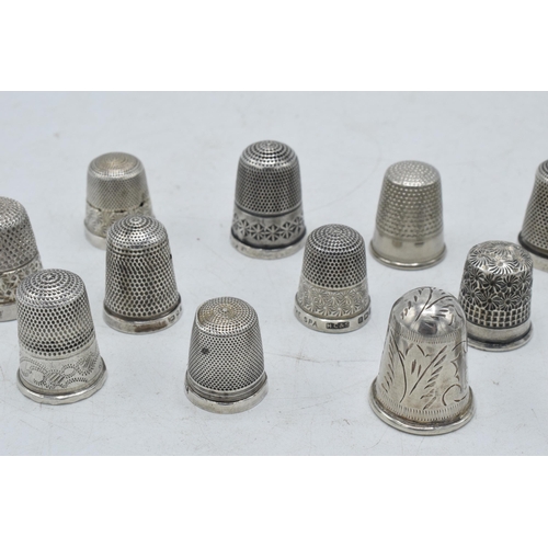 70 - A collection of silver thimbles to include a set of three with etched star, by Henry Griffiths and S... 