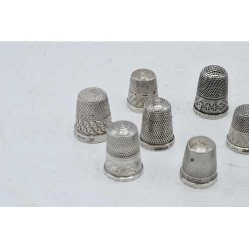 70 - A collection of silver thimbles to include a set of three with etched star, by Henry Griffiths and S... 