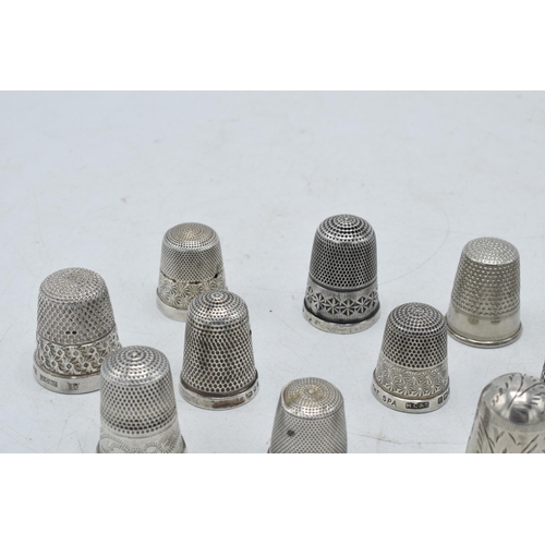 70 - A collection of silver thimbles to include a set of three with etched star, by Henry Griffiths and S... 