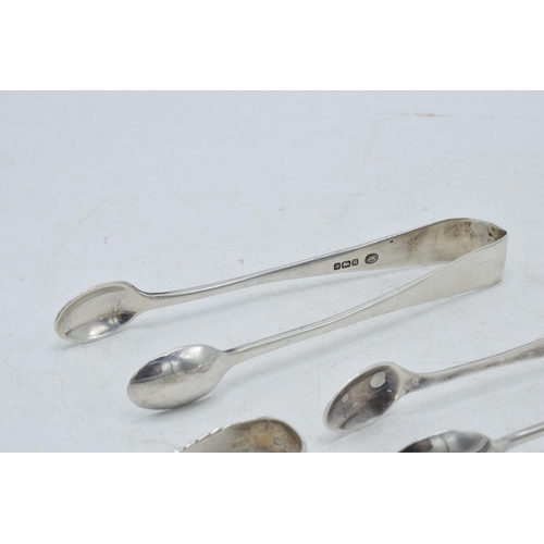 71 - A collection of hallmarked silver sugar tongs to include a plain pair and others with ornate designs... 