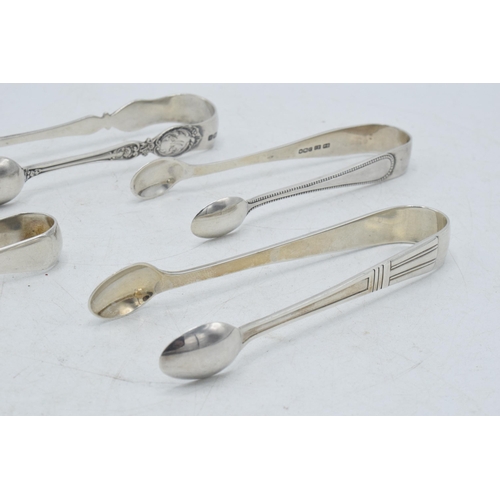 72 - A collection of hallmarked silver sugar tongs to include a pair with scaled claw nips and other desi... 