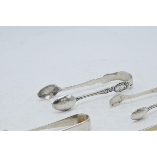 72 - A collection of hallmarked silver sugar tongs to include a pair with scaled claw nips and other desi... 