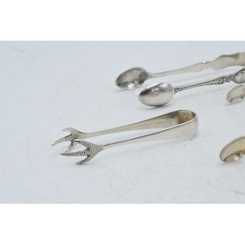 72 - A collection of hallmarked silver sugar tongs to include a pair with scaled claw nips and other desi... 