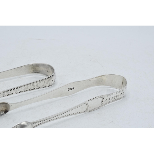 73 - Two pairs of Scottish silver tongs to include a Georgian pair of plain form, Edinburgh 1805, hallmar... 