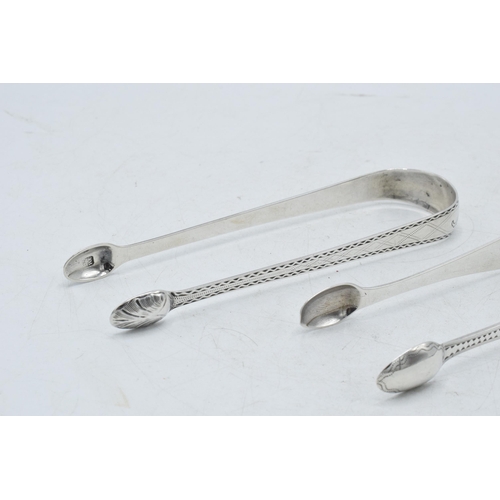 73 - Two pairs of Scottish silver tongs to include a Georgian pair of plain form, Edinburgh 1805, hallmar... 