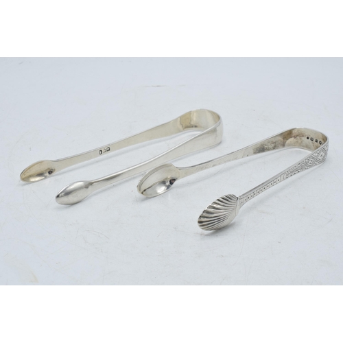 74 - Two pairs of Georgian silver sugar tongs with bright cut engraved decoration, one pair hallmarked Th... 