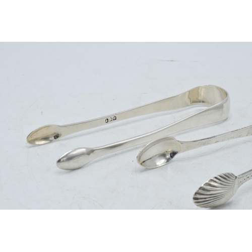 74 - Two pairs of Georgian silver sugar tongs with bright cut engraved decoration, one pair hallmarked Th... 