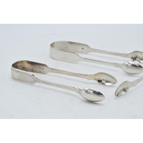 75 - Three pairs of Victorian sugar tongs to include a pair with foliate engraving, Martin, Hall & Co She... 