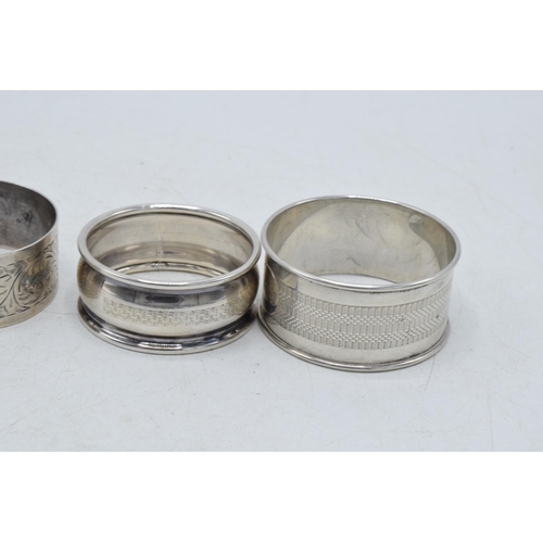 77 - A collection of silver napkin rings to include Chester 1920, Thomas Bradbury & Sons Sheffield 1916, ... 