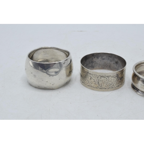 77 - A collection of silver napkin rings to include Chester 1920, Thomas Bradbury & Sons Sheffield 1916, ... 