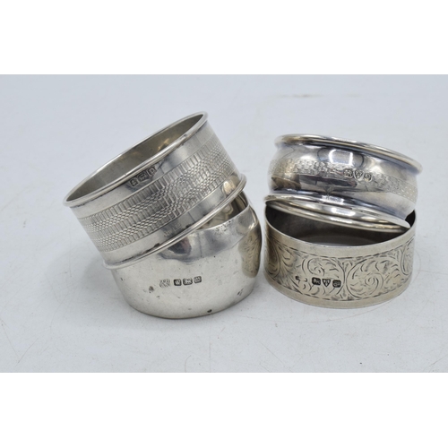 77 - A collection of silver napkin rings to include Chester 1920, Thomas Bradbury & Sons Sheffield 1916, ... 