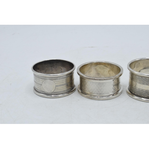 78 - A selection of silver napkin rings to include Rolason Brothers Birmingham 1924, Hazlewoods Birmingha... 