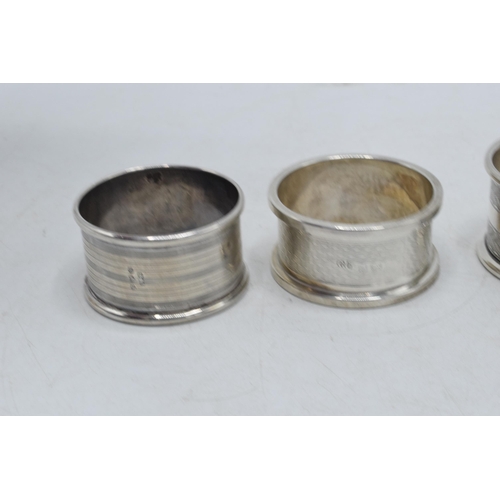 78 - A selection of silver napkin rings to include Rolason Brothers Birmingham 1924, Hazlewoods Birmingha... 