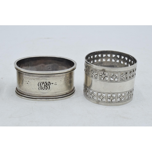 79 - A trio of silver napkin rings of varying designs to include Martin, Hall & Co Sheffield 1881, Colin ... 