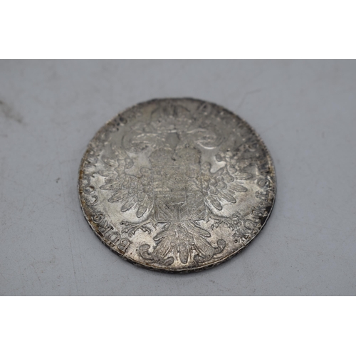 8 - Maria Theresia silver Thaler together with a Royal Wedding Commemorative Coin (2).