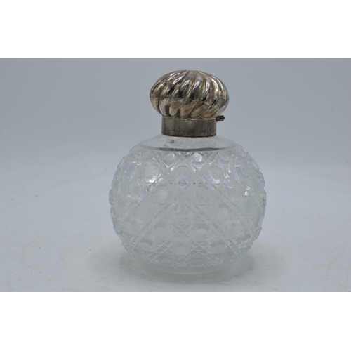 83 - Silver topped cut glass globular scent bottle with swirl decoration lid, Birmingham 1889, with stopp... 