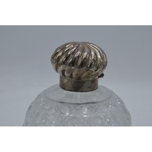 83 - Silver topped cut glass globular scent bottle with swirl decoration lid, Birmingham 1889, with stopp... 