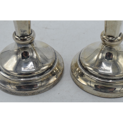 84 - A pair of hallmarked silver vases with shaped rims, Birmingham 1917, Sanders and MacZenzie, 18cm tal... 