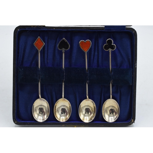 85 - A set of 4 hallmarked silver tea spoons, handles decorated with enamelled card suits, Birmingham 192... 