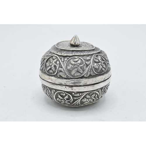 86 - Indian silver bowl and cover with repousse decoration, 76.1 grams, 7cm diameter.