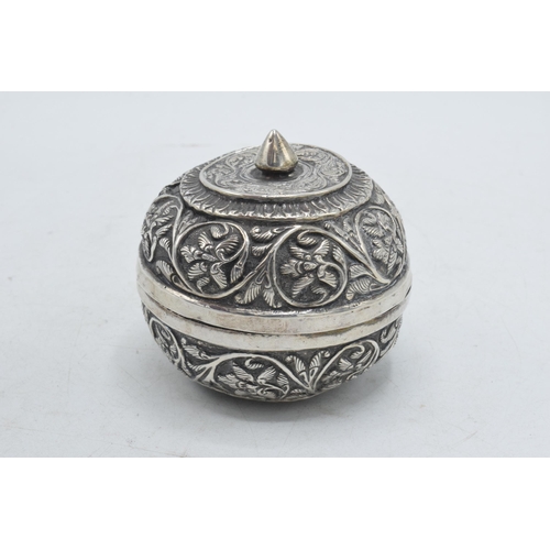 86 - Indian silver bowl and cover with repousse decoration, 76.1 grams, 7cm diameter.