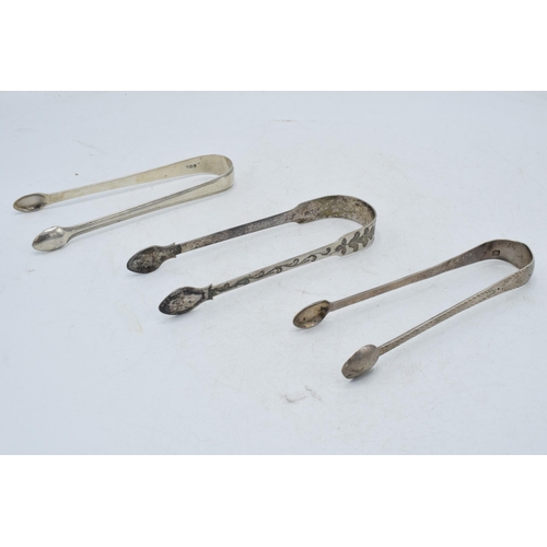 97 - A trio of silver sugar tongs to include 2 Georgian pair and one similar, 102.1 grams (3).