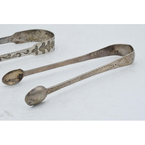 97 - A trio of silver sugar tongs to include 2 Georgian pair and one similar, 102.1 grams (3).