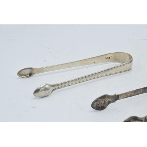 97 - A trio of silver sugar tongs to include 2 Georgian pair and one similar, 102.1 grams (3).