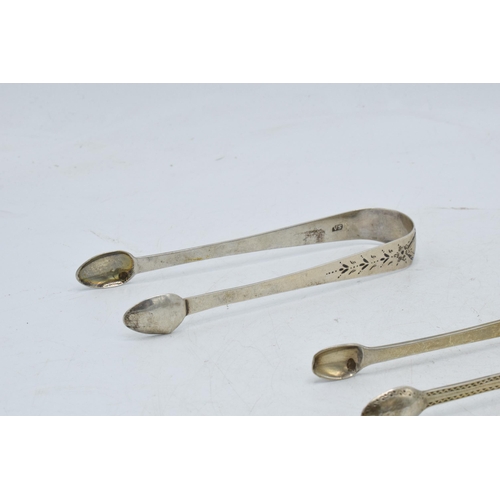 98 - A trio of hallmarked silver sugar tongs of varying designs to include 2 Georgian pairs and a similar... 