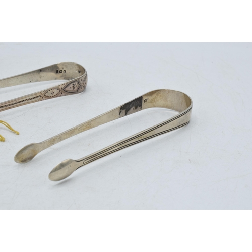 99 - A trio of Georgian sugar tongs, one with bright cut decoration and 2 similar, 92.7 grams (3).