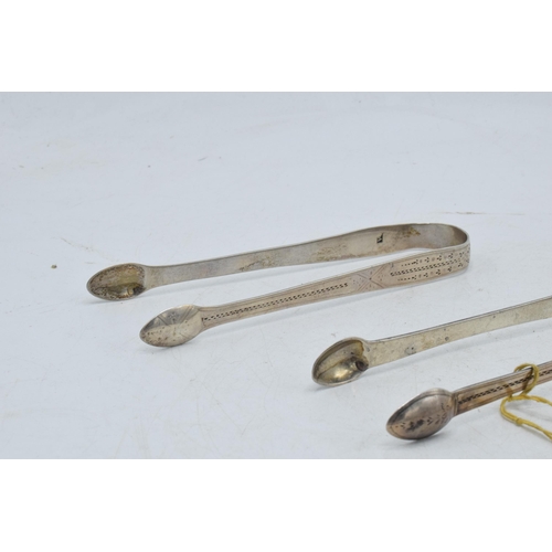 99 - A trio of Georgian sugar tongs, one with bright cut decoration and 2 similar, 92.7 grams (3).