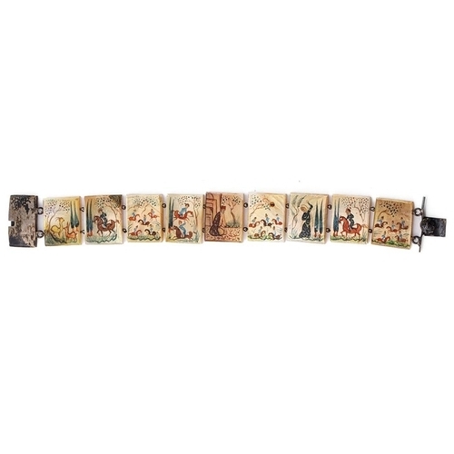 445 - An early 20th century silver bracelet with Mother of Pearl panels with painted oriental designs, 20c... 