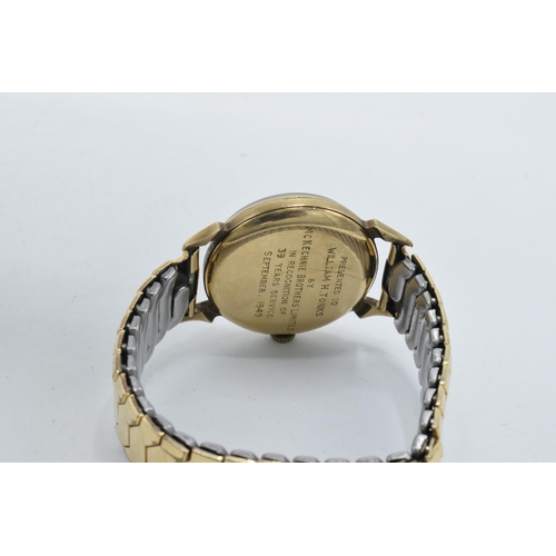 229A - Smiths 9ct gold cased wristwatch on gold plated metal strap, with inscription to rear.