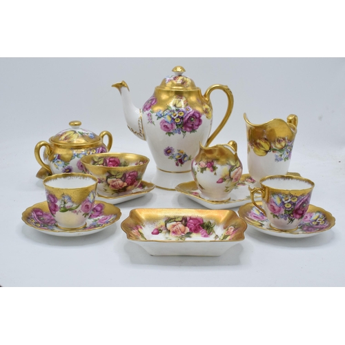 Royal Chelsea English Bone China Golden Rose tea ware to include a coffee pot, 2 cups and saucers, 2 large trays, 1 shorter tray, 2 cream jugs and 2 sugar pots (12 pieces). In good condition with no obvious damage or restoration. Surface wear / some wear to gilding.