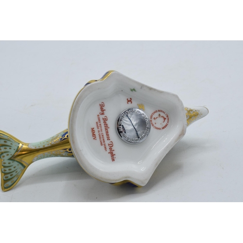 35A - Royal Crown Derby paperweight in the form of a Baby Bottlenose Dolphin, with silver stopper.
