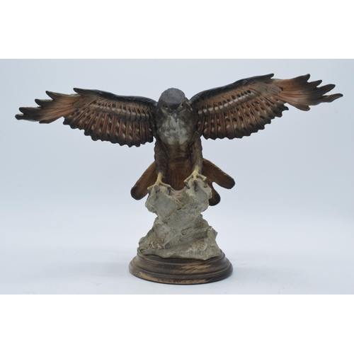 58 - Capo Di Monte realistic model of an Eagle / Bird of Prey landing on a rocky surface, 34cm wide.