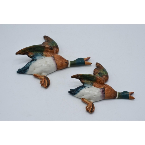 78 - Beswick flying mallard wall plaques to include 596-3 and 596-4 (this piece is damaged in several pla... 