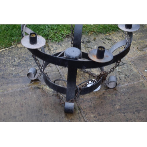 482 - A good collection of 12 wrought iron medieval style chandeliers / hanging candle with electrical wir... 