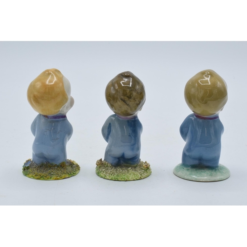 136 - A trio of Wade Wynken figures, 1950s, with 2 having moulded floral base and one plain, 7cm tall (3 -... 