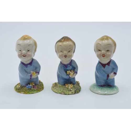 136 - A trio of Wade Wynken figures, 1950s, with 2 having moulded floral base and one plain, 7cm tall (3 -... 