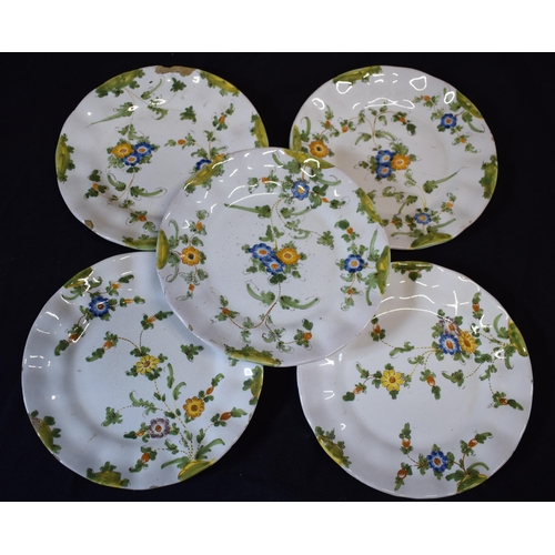 137 - A group of 5 18th century faience ware plates with floral designs and indistinct signature to rear (... 